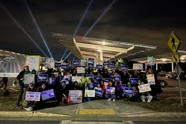 Howard County library workers rally outside of Evening in the Stacks event
